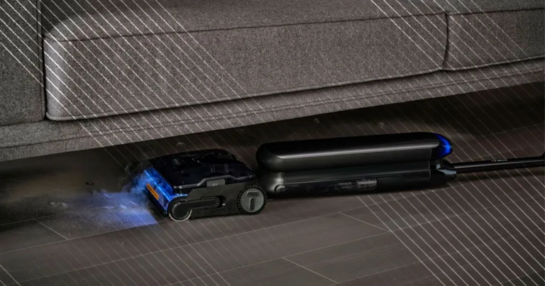 Tineco Steam One S9 Artist laying flat underneath a grey couch