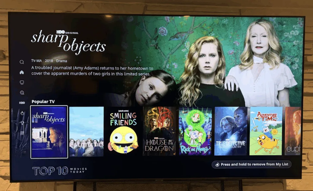 Photo of a TV showing the HBO Max menu with a carousel of TV shows labelled “Popular TV.”