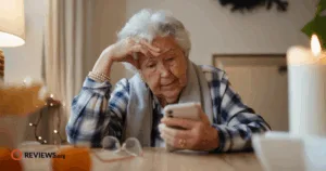 Elderly woman looking at cell phone