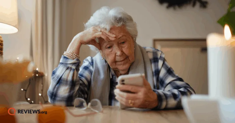 Elderly woman looking at cell phone