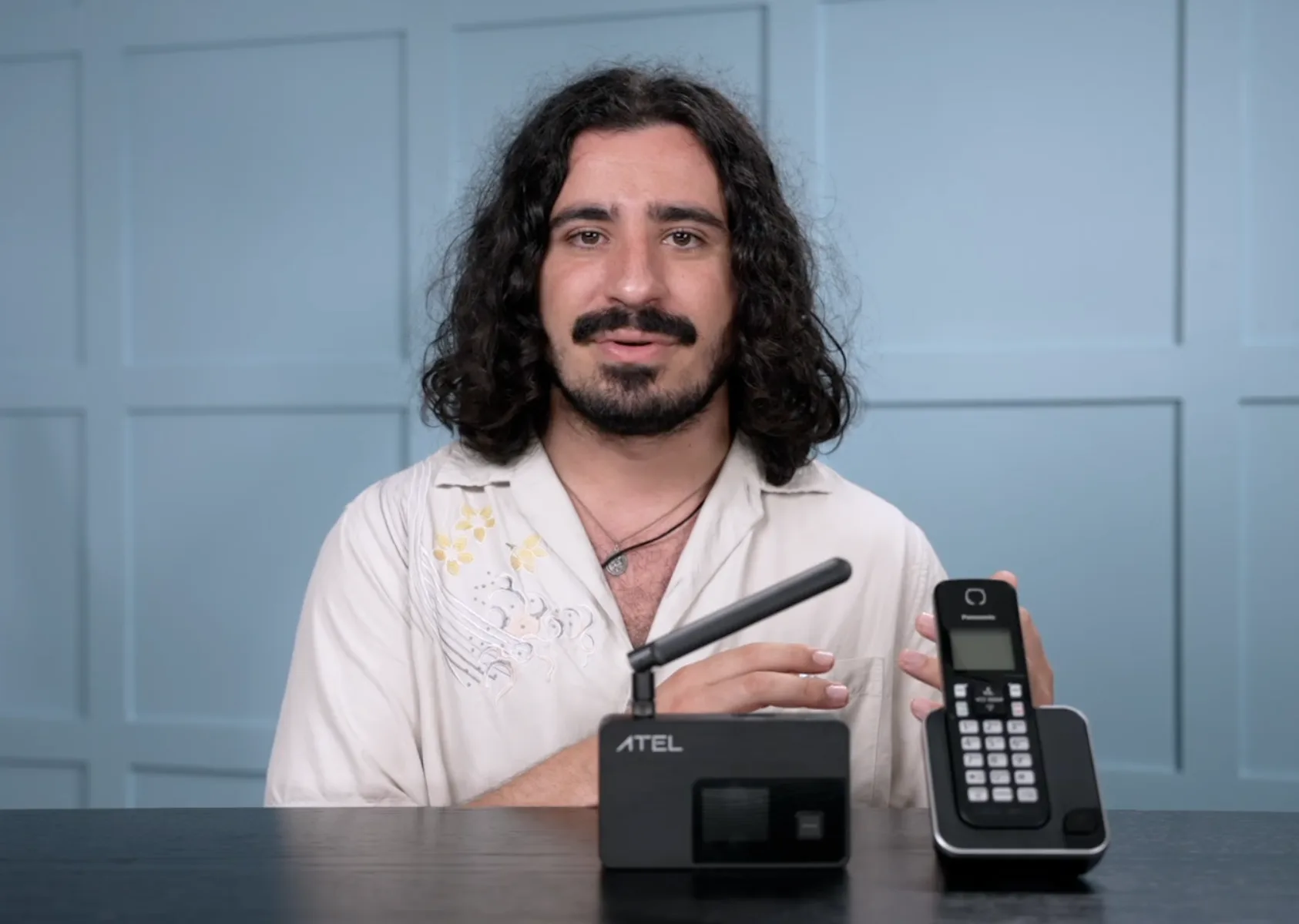 A screenshot of a US Mobile home phone setup video.