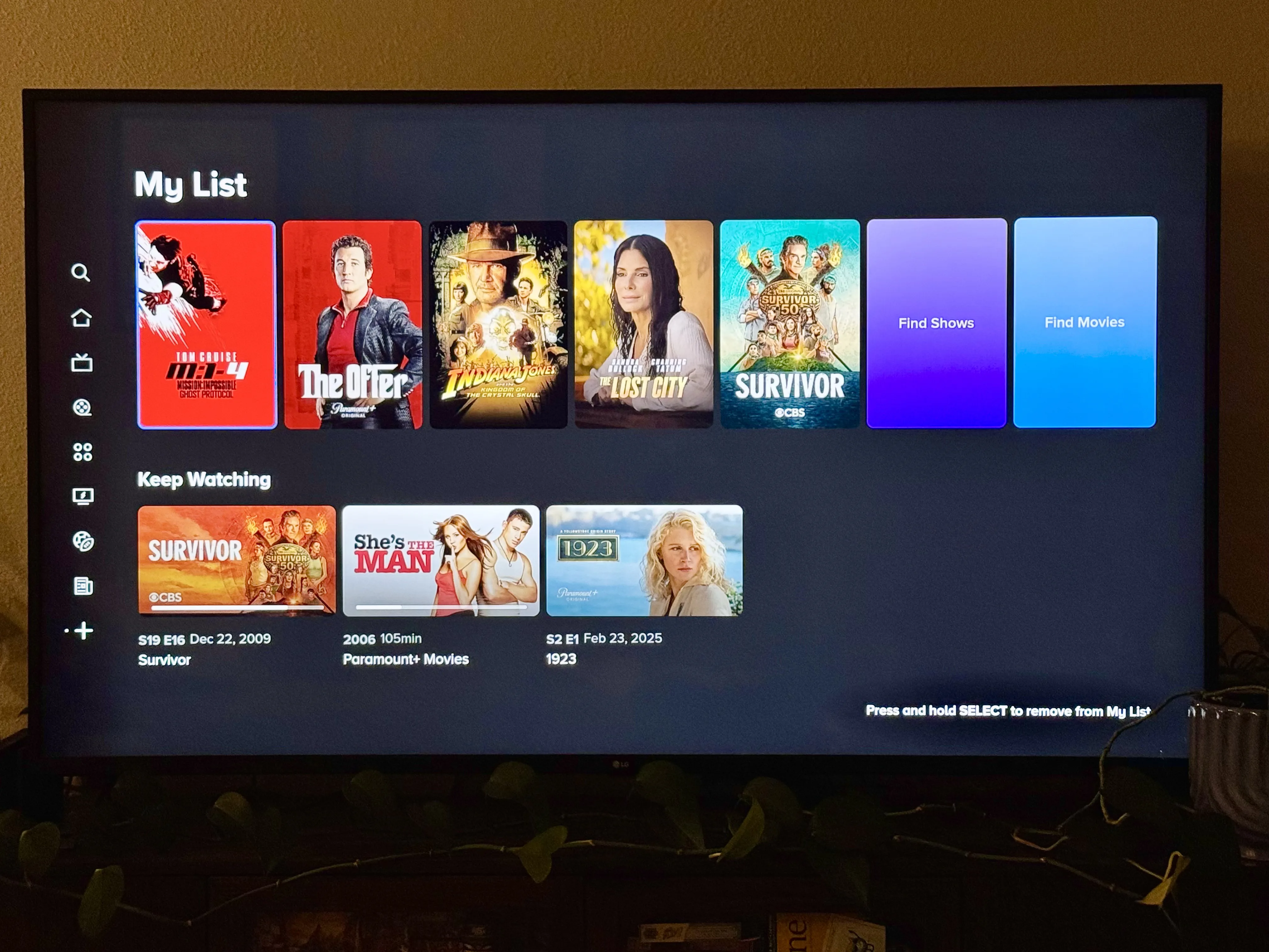 Paramount Plus review featuring a photo of a TV with the app open to its watchlist screen with a list of movies and shows saved to watch later and a list of shows to keep watching.