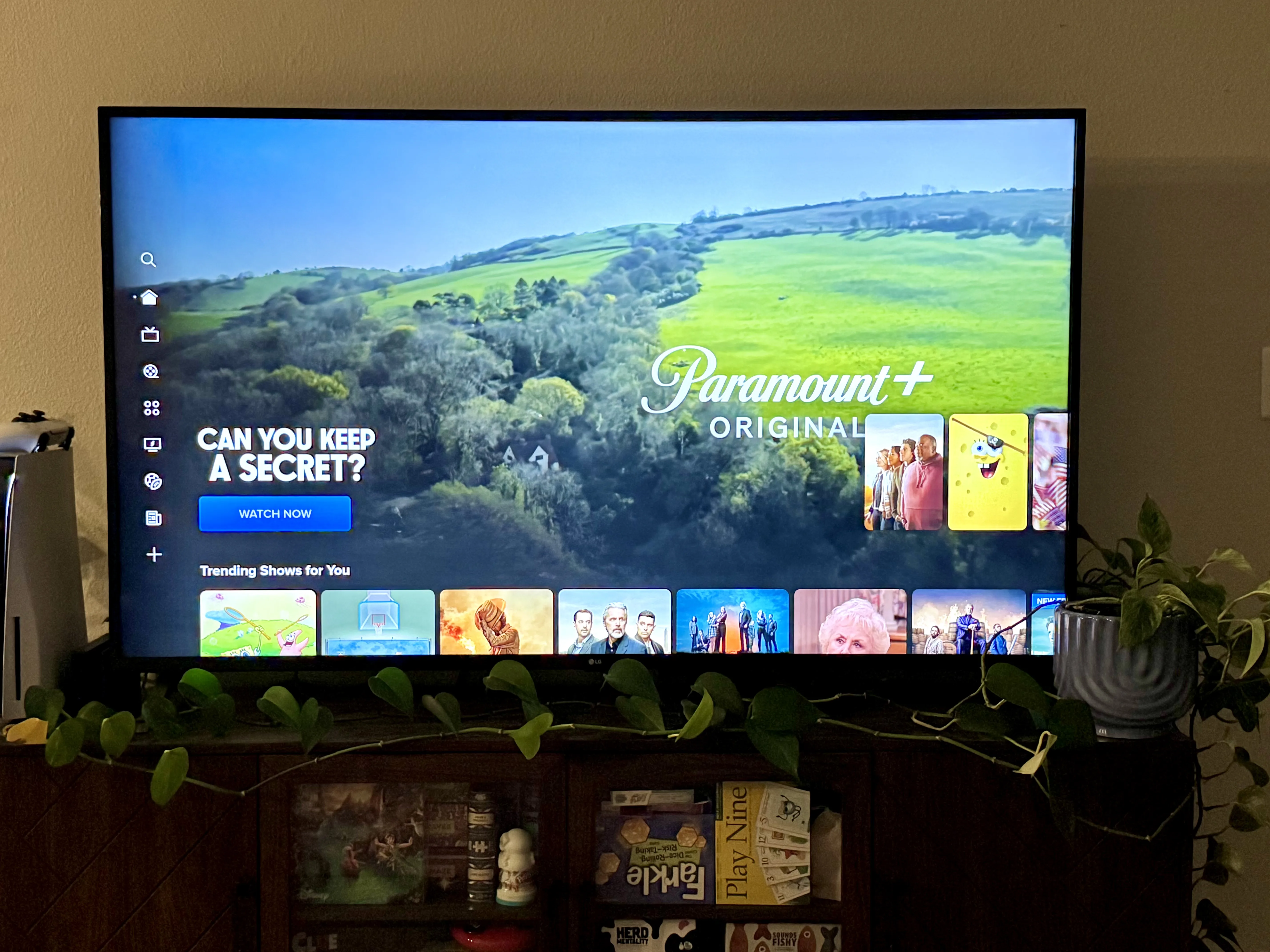 Paramount Plus review featuring a photo of a TV with the app open to its home screen and featuring a TV show called “Can You Keep a Secret?”