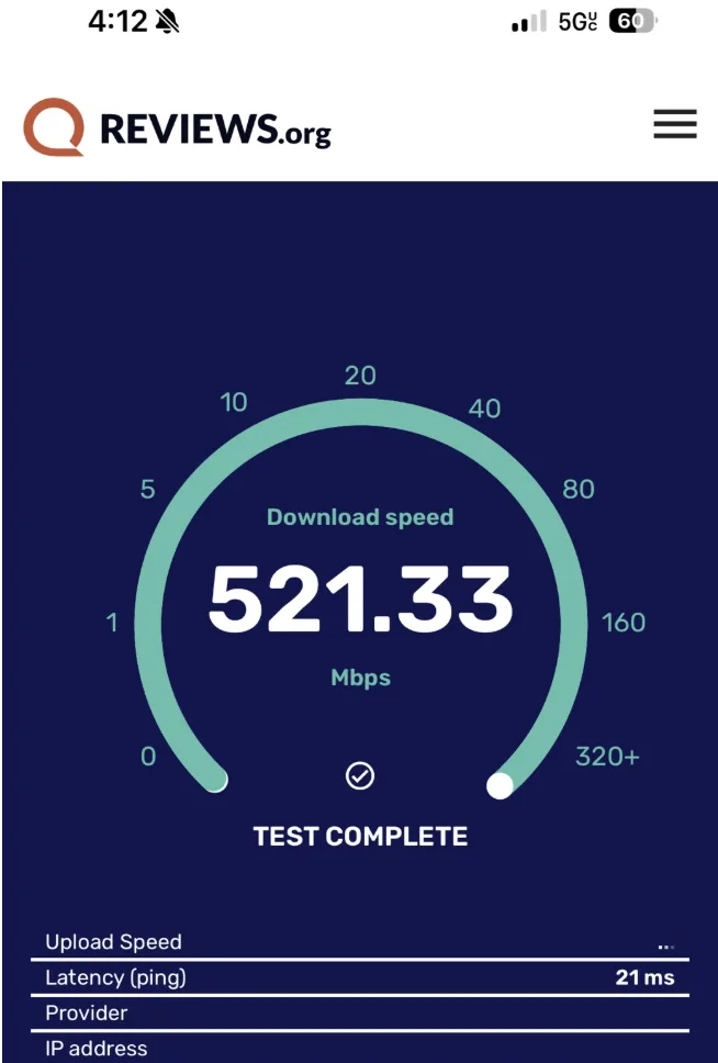 A screenshot of Reviews.org’s download speed test for a T-Mobile 5G internet connection showing 521.33Mbps.