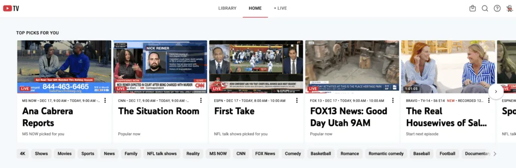 A YouTube TV "Home" interface screen for live TV streaming showing the "Top Picks For You" section with various live news and entertainment thumbnails. The tiles include programs like Ana Cabrera Reports, The Situation Room, and First Take, with category tags like 4K, Sports, and Reality visible along the bottom