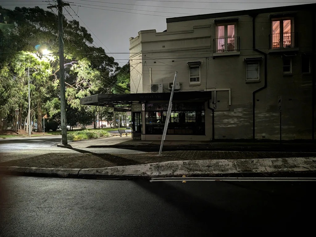 Pixel 10a camera sample photo of barber shop at night in night mode