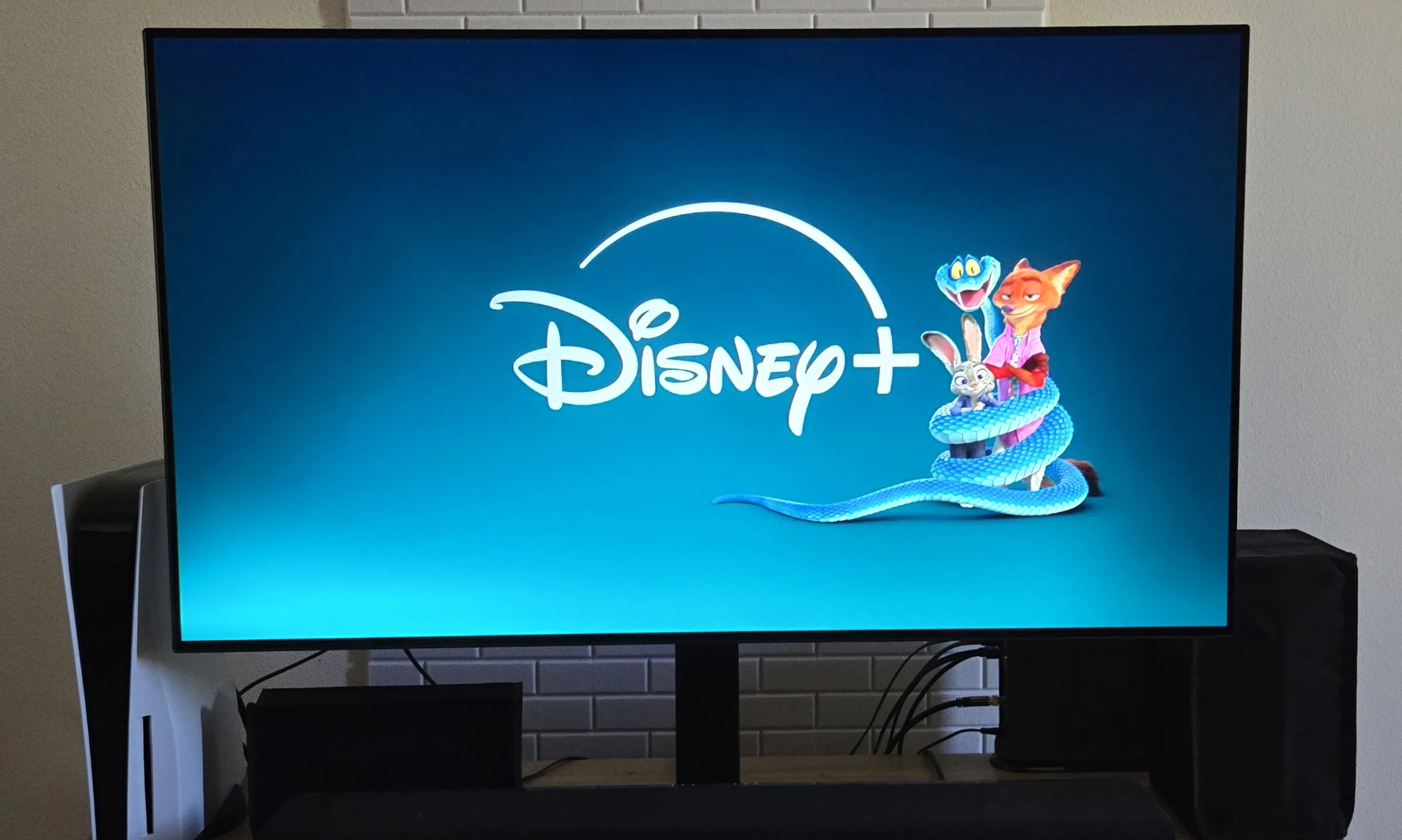 The Disney Plus logo appears as you enter the app on a television. The logo is accompanied by characters from the Disney animated film, “Zootopia 2.”