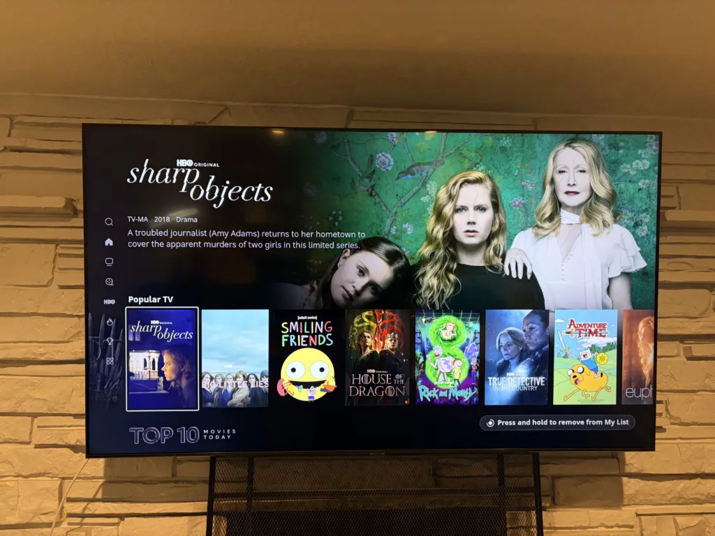 HBO Max content library menu on a smart TV, highlighting the show “Sharp Objects.”