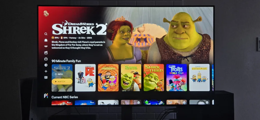 A photo of a TV showing the Peacock app and the various children's movies available.
