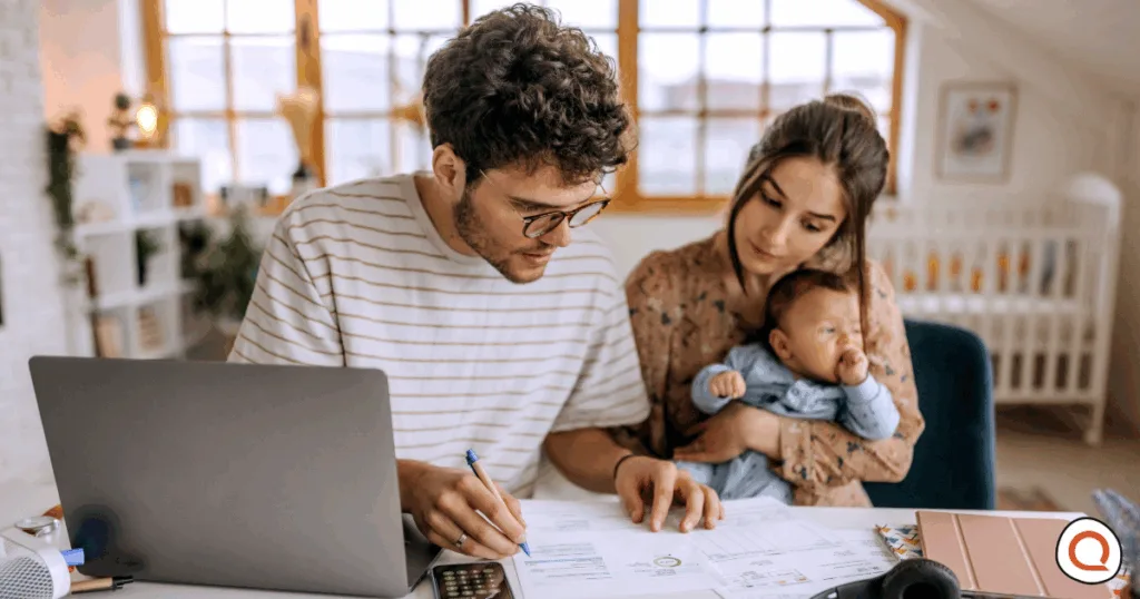 Young family going over finances together at home with baby. Image credit: iStock/Pekic