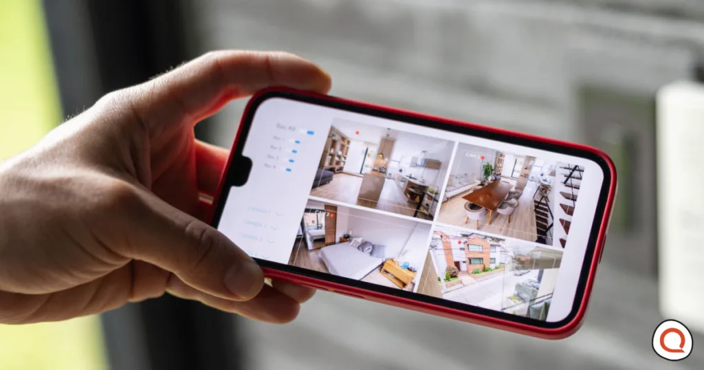 Smartphone displaying multiple live feeds from AI home security cameras monitoring rooms and outdoor areas in real time