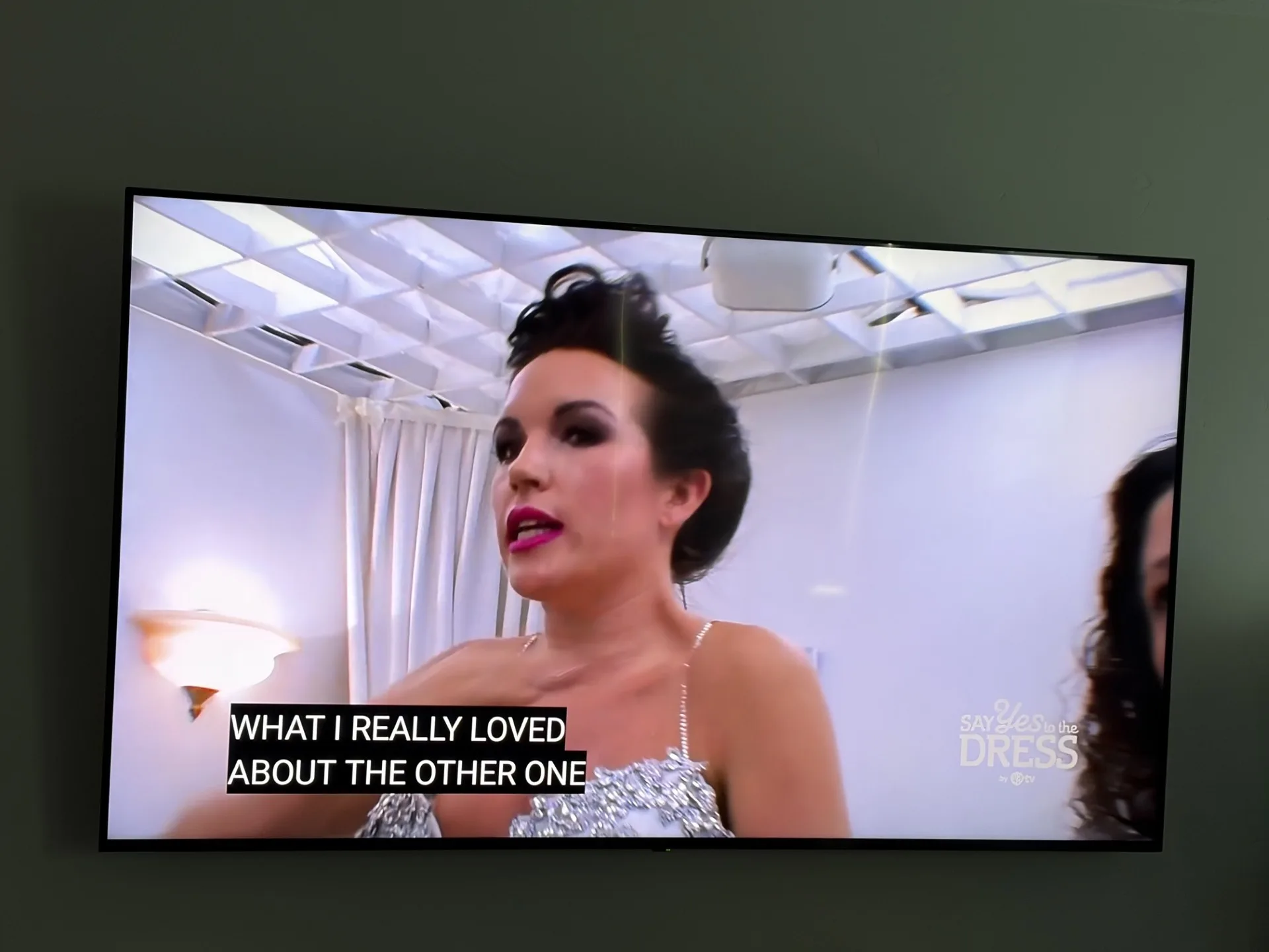 TV screen showing a frame from a live episode of Say Yes to the Dress on TLC through DIRECTV streaming