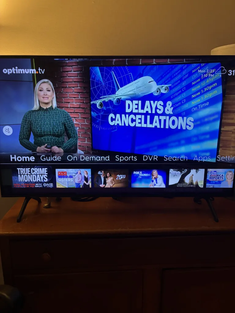 Smart TV with Optimum TV news coverage and a row of show options.