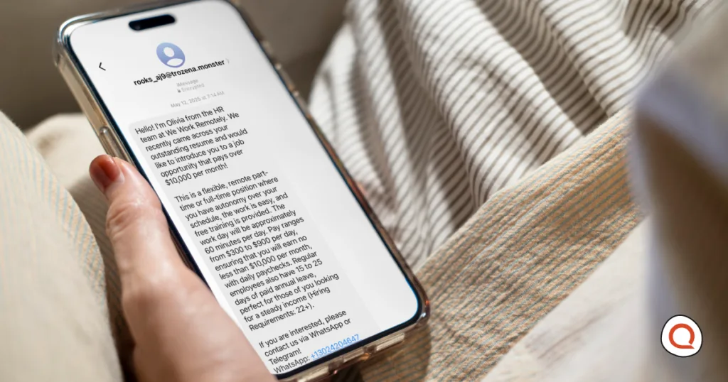 A person holds a phone displaying a scam text message offering a suspicious high-paying remote job, illustrating common text message scams.