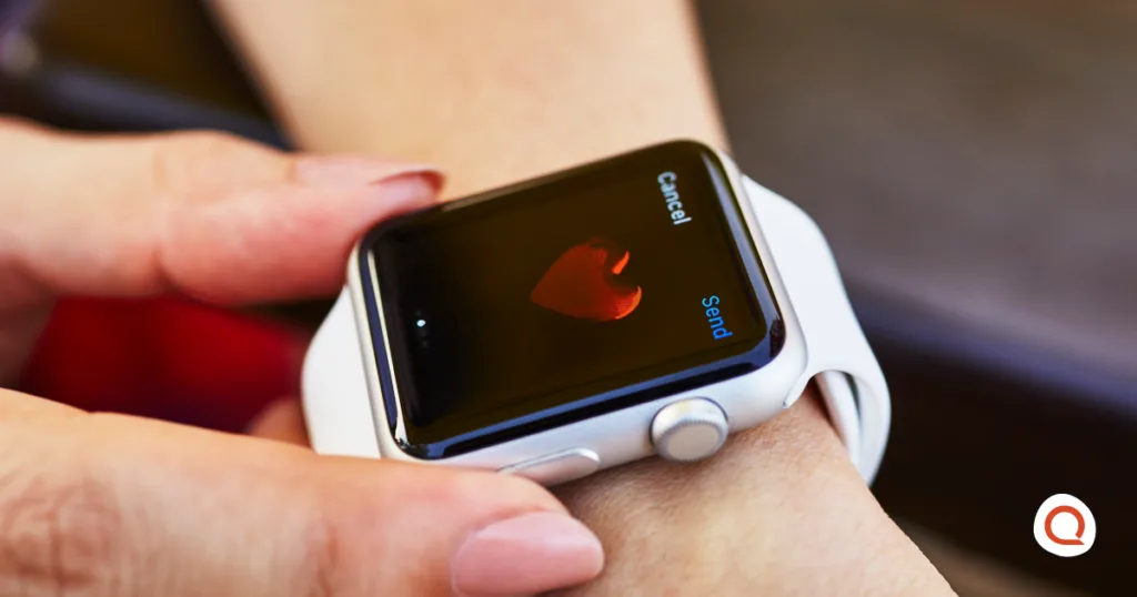Person sends a heart message from an Apple Watch on their wrist.