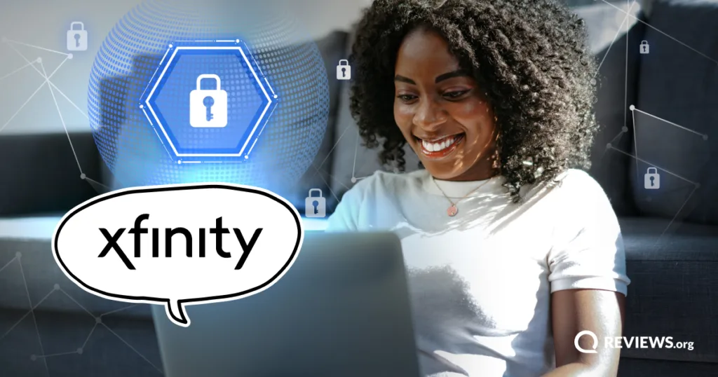 A woman smiles while using her laptop at home, protected by Xfinity's WiFi Shield and Shield Select security features.