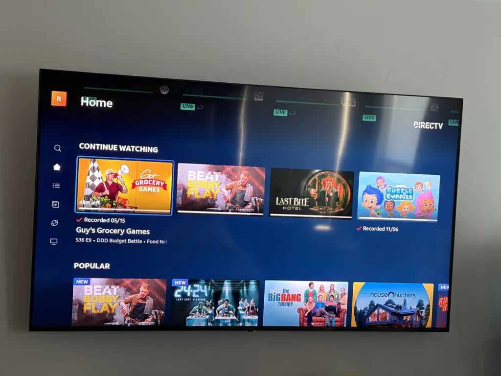 DIRECTV Stream home screen showing a Continue Watching row with Guy's Grocery Games, Beat Bobby Flay, Last Bite Hotel, and Bubble Guppies, plus a Popular row with The Big Bang Theory and House Hunters.
