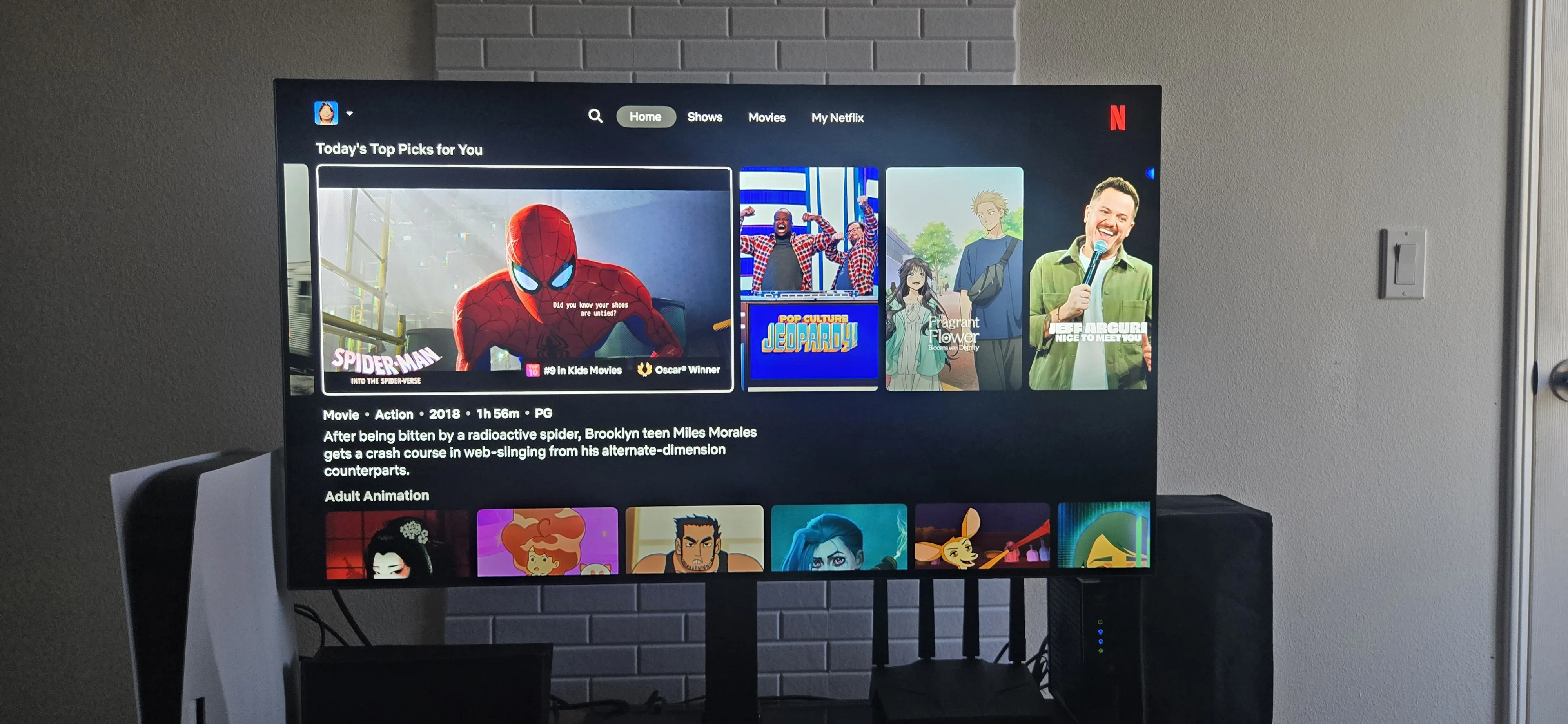 An image from Netflix with the top AI recommendations. It includes “Spider-Man: Into the Spider-Verse,” “Pop Culture Jeopardy,” “The Fragrant Flower Blooms with Dignity,” and “Jeff Arcuri: Nice to Meet You.”