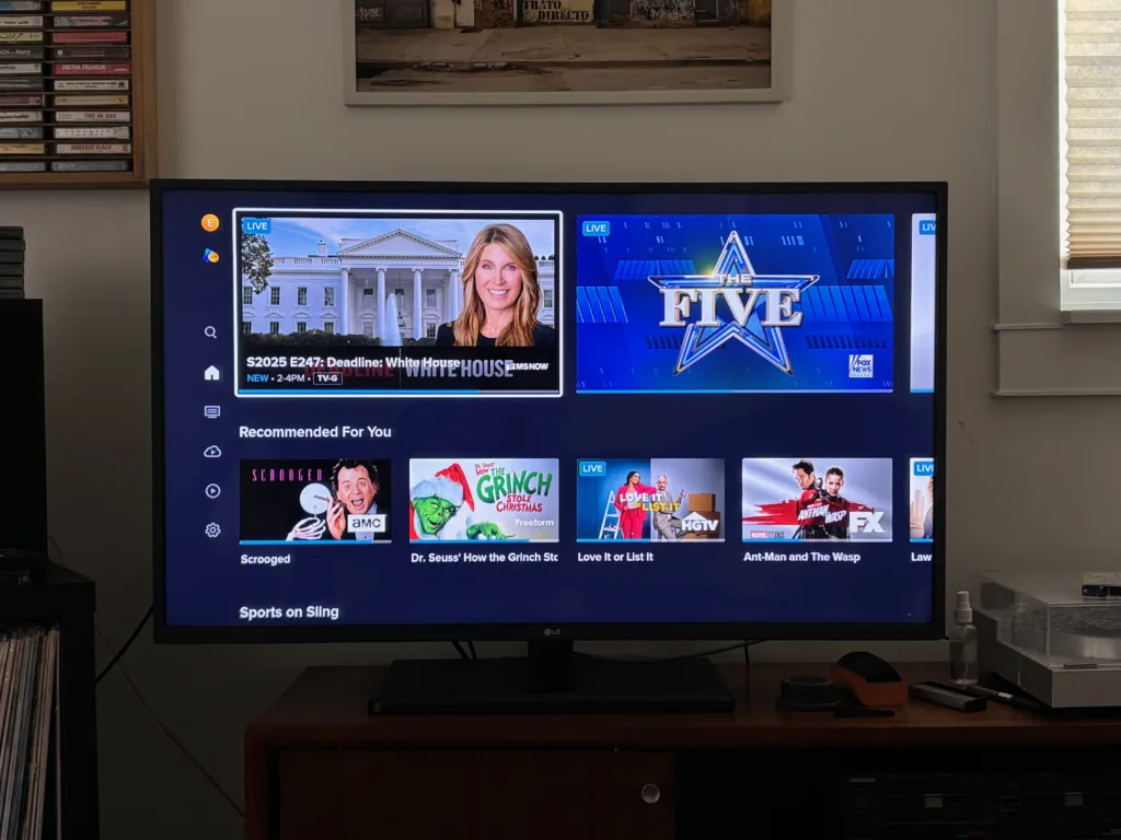 Sling TV home screen showing live MSNBC and Fox News tiles at top, a Recommended For You row with Scrooged, The Grinch, Love It or List It, and Ant-Man and The Wasp, and a Sports on Sling section below.