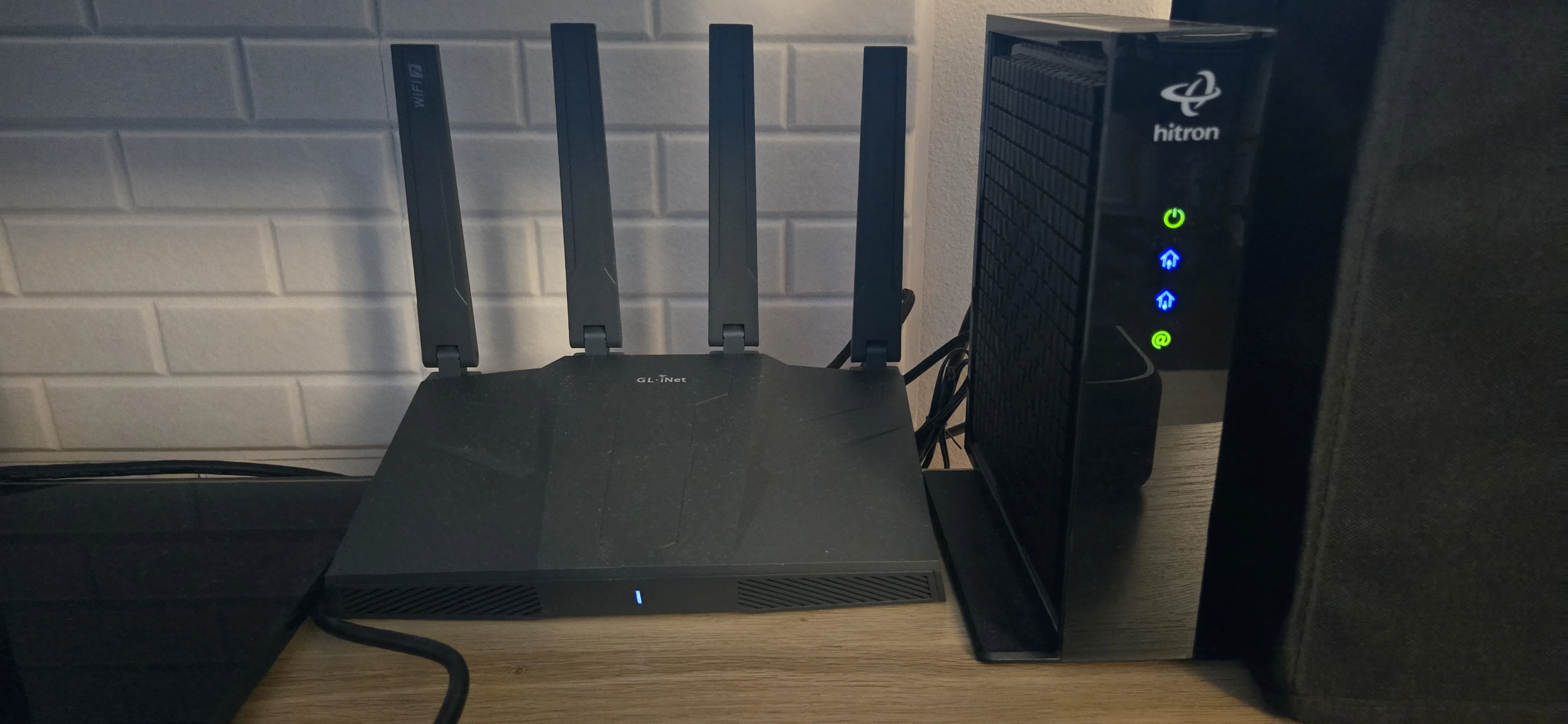 An image of my modem and router that accompanies other media devices.