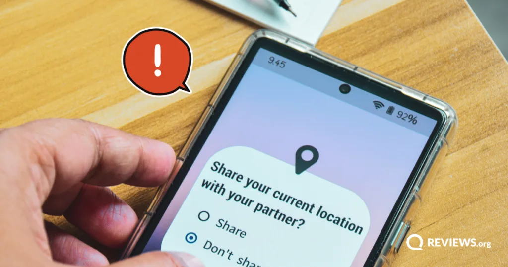 A person hesitates over a phone prompt asking whether to share their current location with their partner.