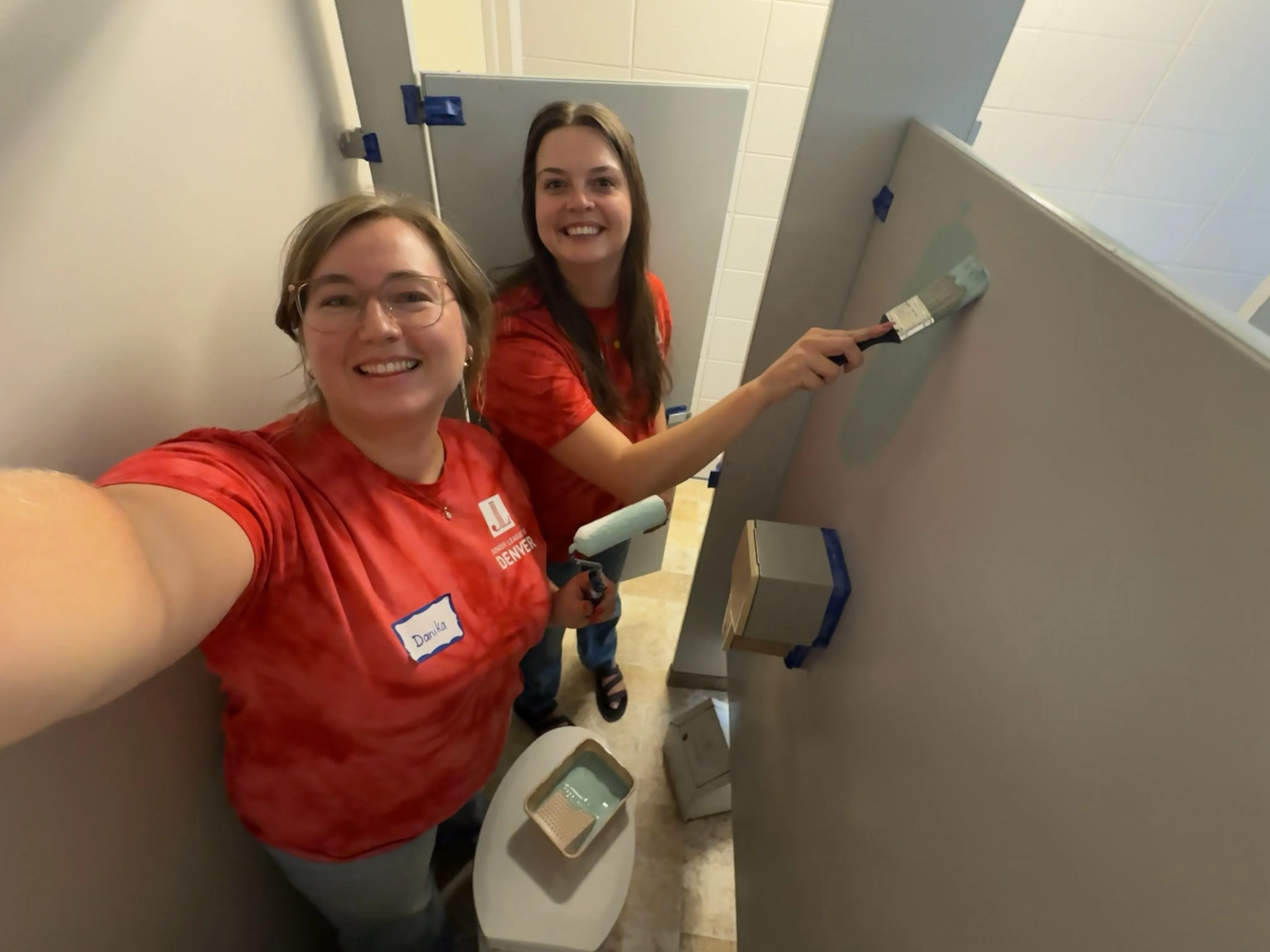 Two volunteers help out in the community instead of using social media